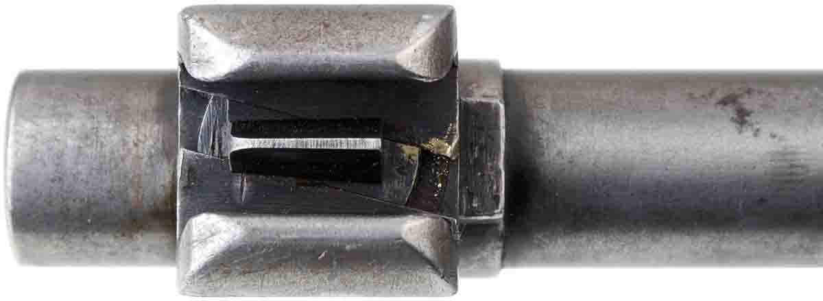 The Model 1935 front sight has a blade that runs in a slanted track. Note the brass smears from drifting it for zeroing.